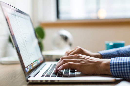 Business owner typing on their laptop
